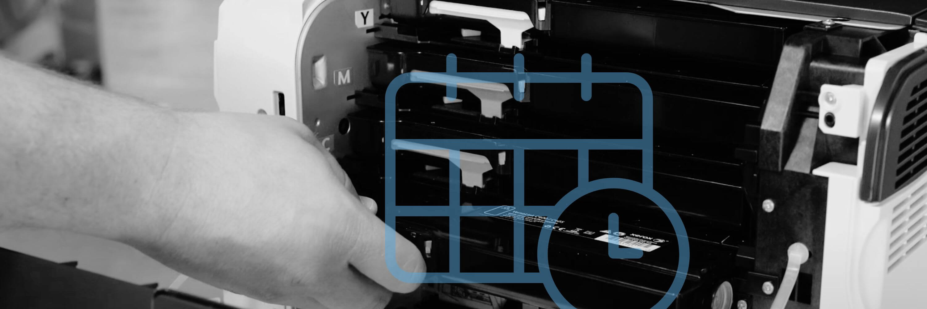 a grayscale image of a hand pulling a toner out of a printer with a calendar graph on top 