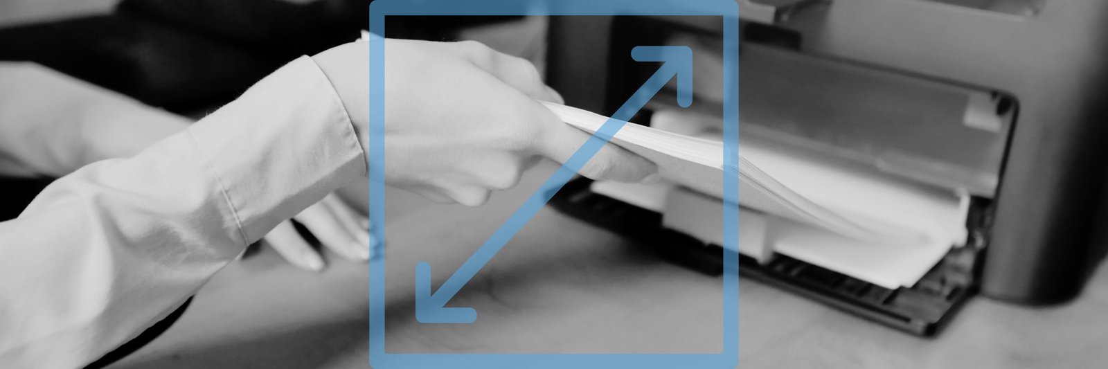 Woman putting paper onto printer