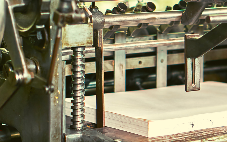 An old school printing press at work.