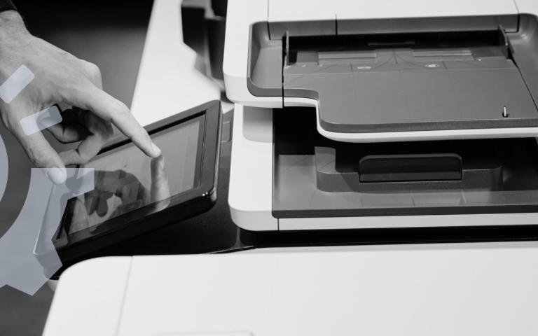 A man using a printer&#039;s screen interface