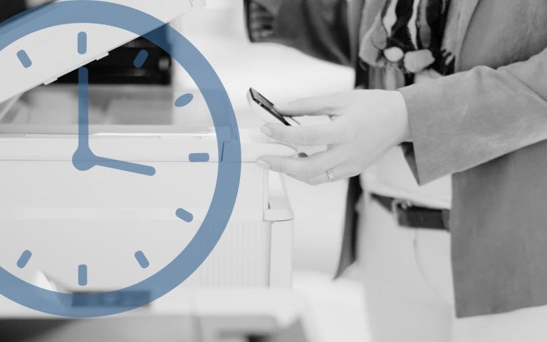 Person using a printer in an office environment