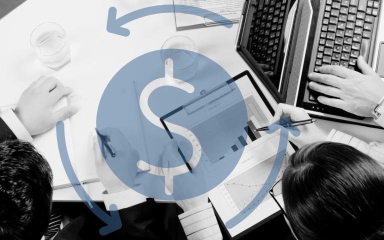 Business workers gathered around a table