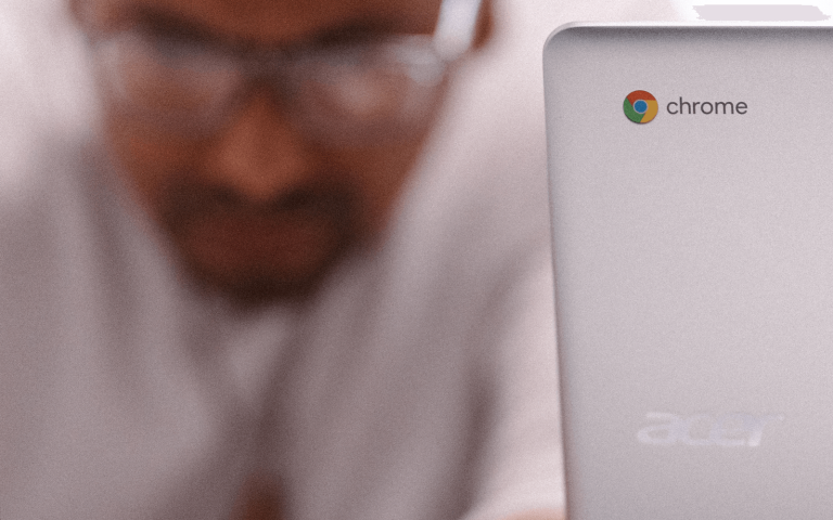 Man working with Chromebook