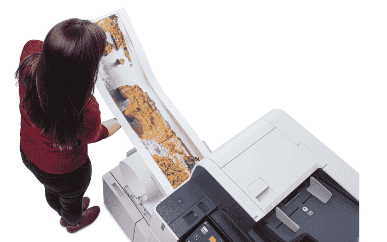Person looking at a color print made from the Xerox AltaLink C8135