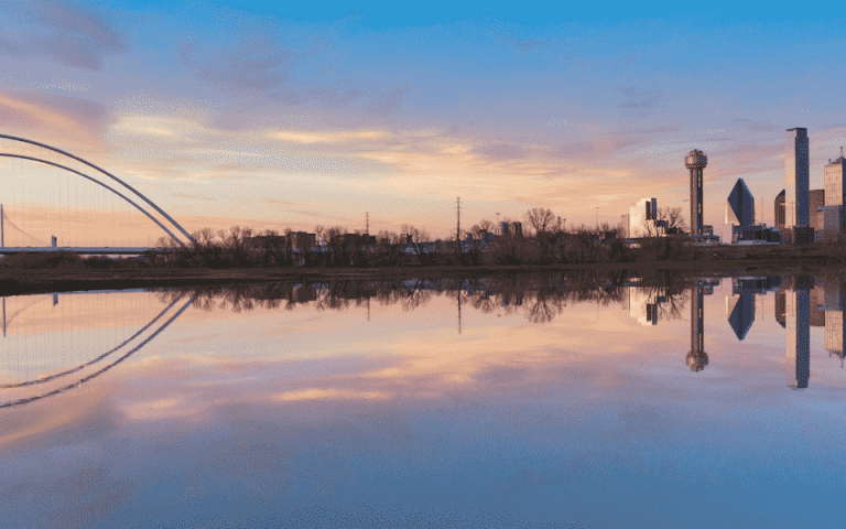 A picture of Dallas and the Margaret Hunt Hill Bridge from a water point of view 