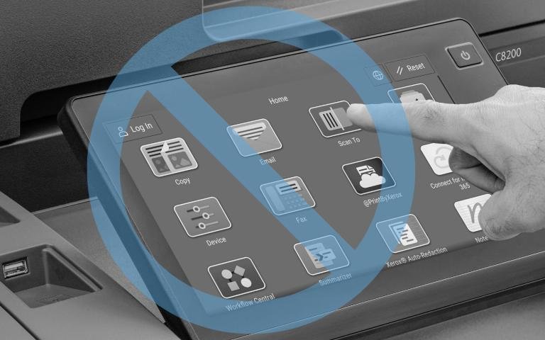 A person using a Xerox touchscreen with apps