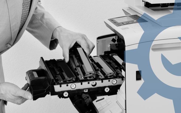 Man replacing toner on a copier
