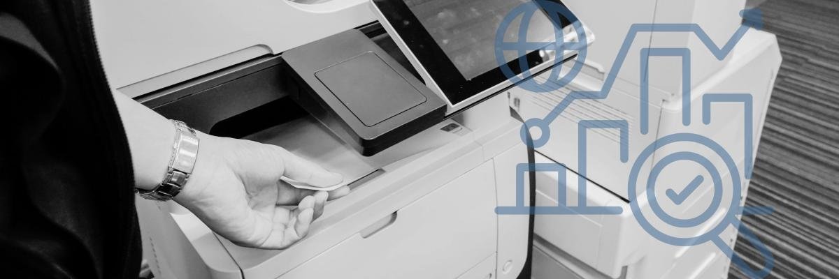 Person using a laser printer in an office