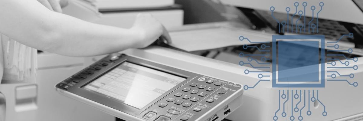 Woman using a color laser printer