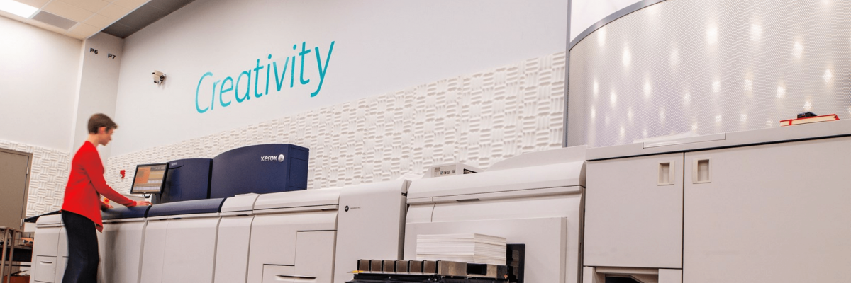 woman standing at printer