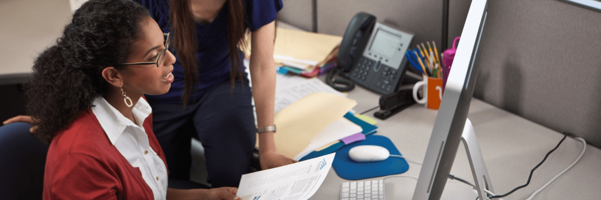 two women collaborating on a document