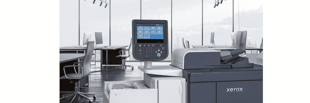 The Xerox PrimeLink B9136 printer in an office with a city view