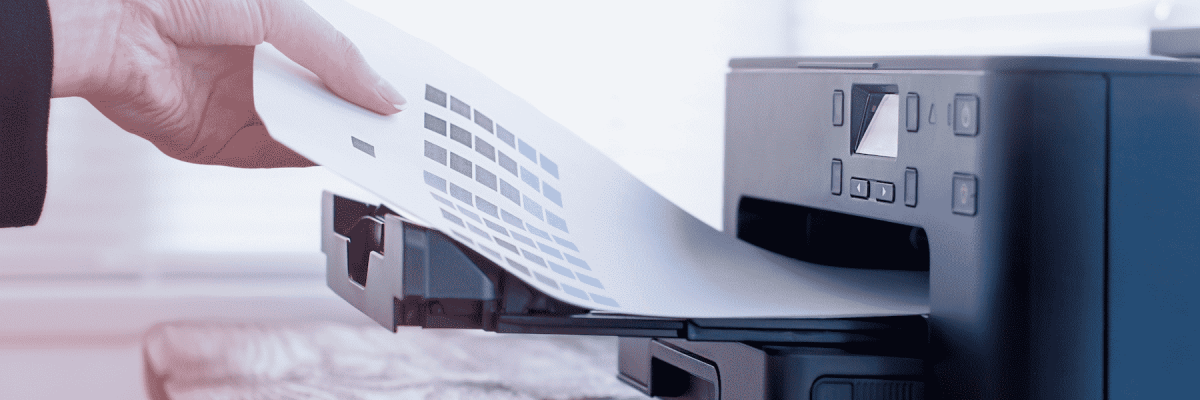 Person taking a document out of a printer tray
