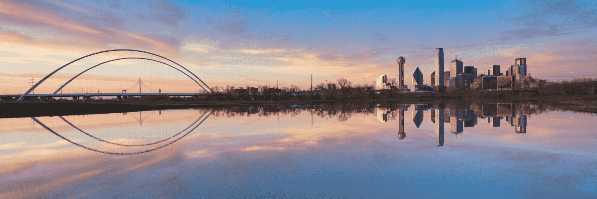 A picture of Dallas and the Margaret Hunt Hill Bridge from a water point of view 