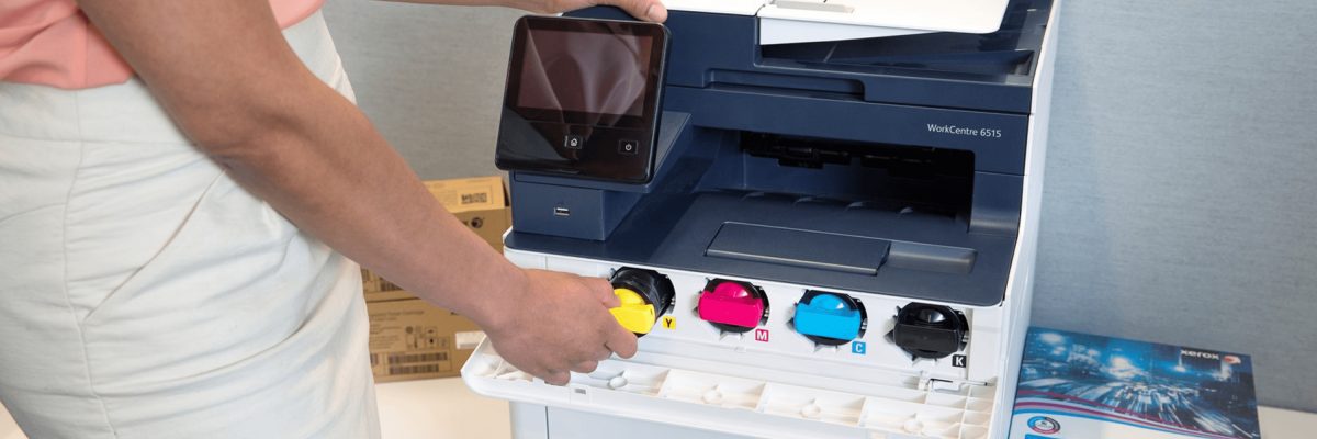 Person changing printer's toner