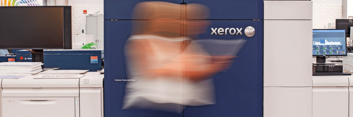 Women walking by Xerox machine