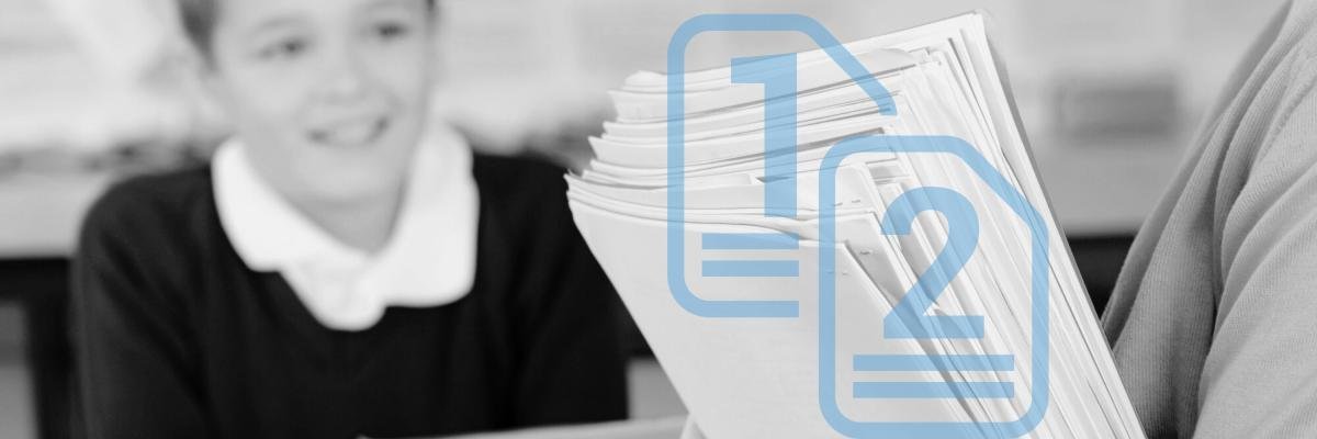 A teacher handing out organized and stacked papers to a classroom