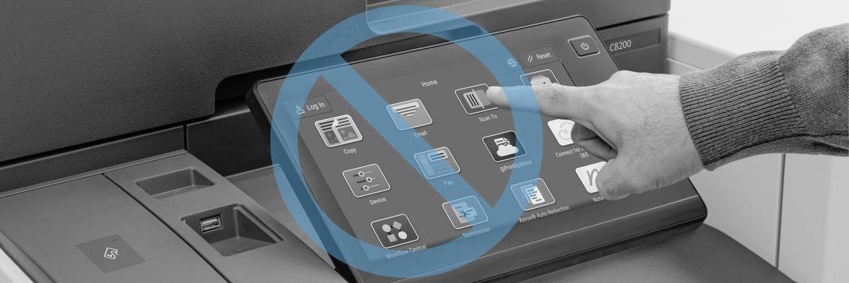 A person using a Xerox touchscreen with apps
