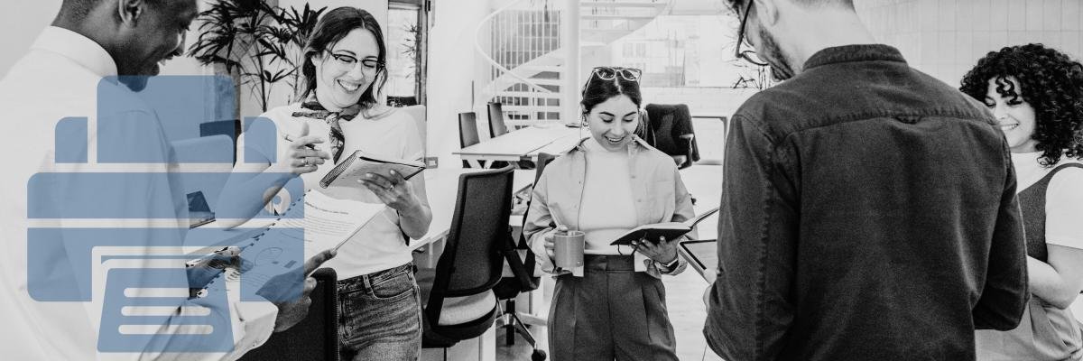Office workers standing around with printed documents