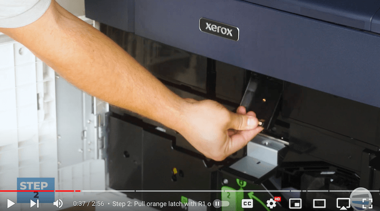 Printer technician lowers the R1 latch and raises the upper latch on the Xerox PrimeLink C9065