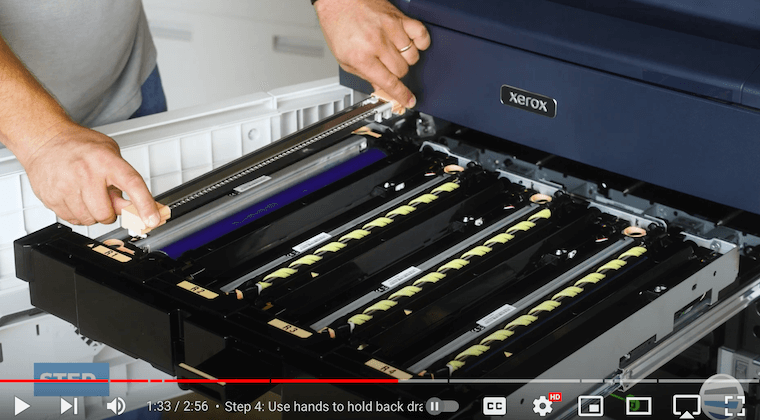 Printer technician removes the corotron assembly on the Xerox PrimeLink C9065
