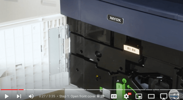 Printer technician points out orange latch with R1-R4 on the Xerox PrimeLink C9065