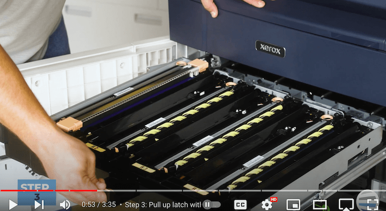Printer technician pulls the drum drawer on the Xerox PrimeLink C9065