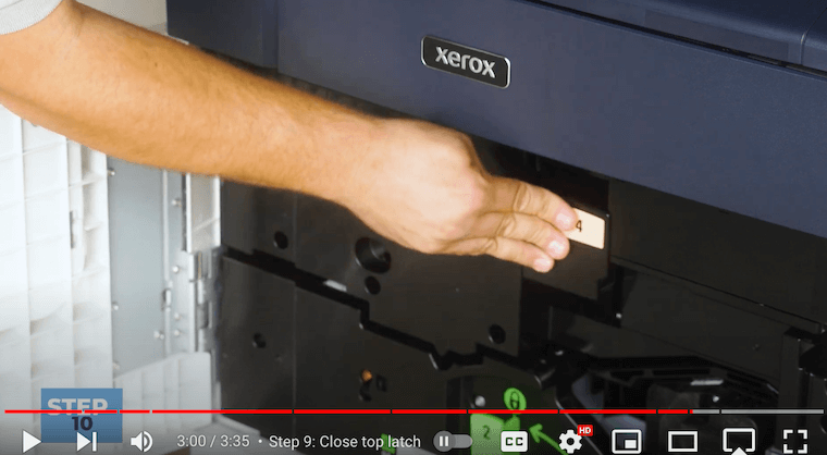 Printer technician closes the top & bottom latch on the Xerox PrimeLink C9065