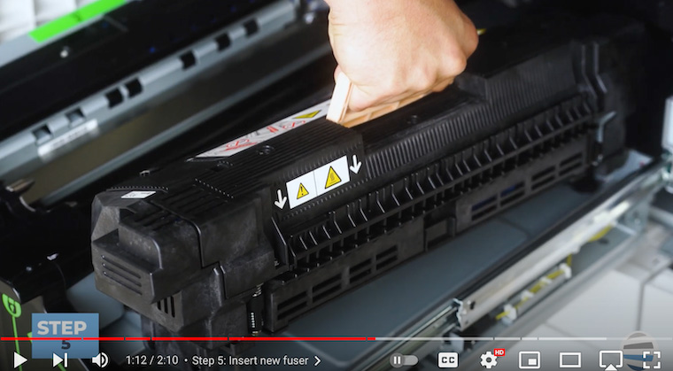 Printer technician inserts new fuser assembly on the Xerox PrimeLink C9065/C9070/C60/C70 Printer