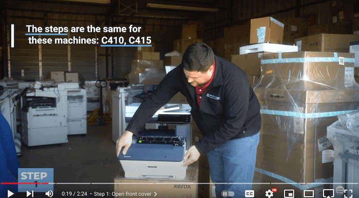 Printer technician opens the front cover of Xerox C410/C415