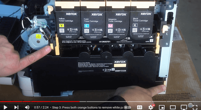 Printer technician removes waste toner bottle of Xerox C410/C415