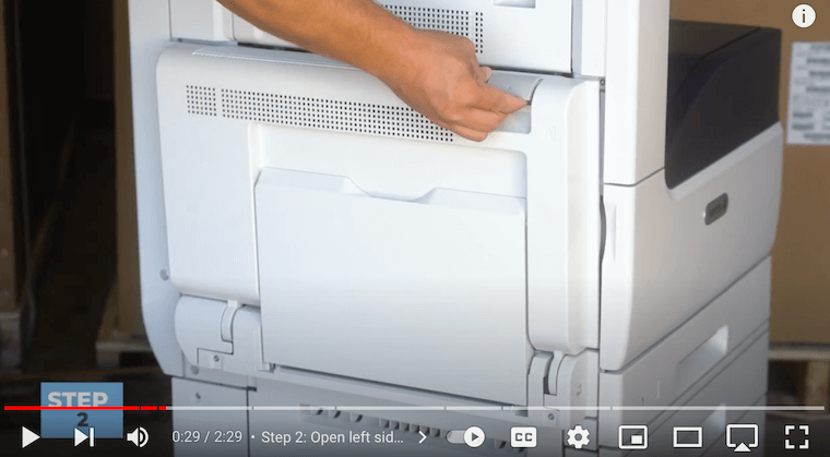 Printer technician opens the left side door on the Xerox VersaLink C7020/C7025/C7030 Printer