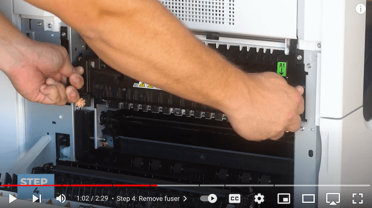 Printer technician removes the fuser on the Xerox VersaLink C7020/C7025/C7030 Printer