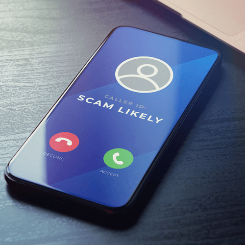 A phone shows a scam call